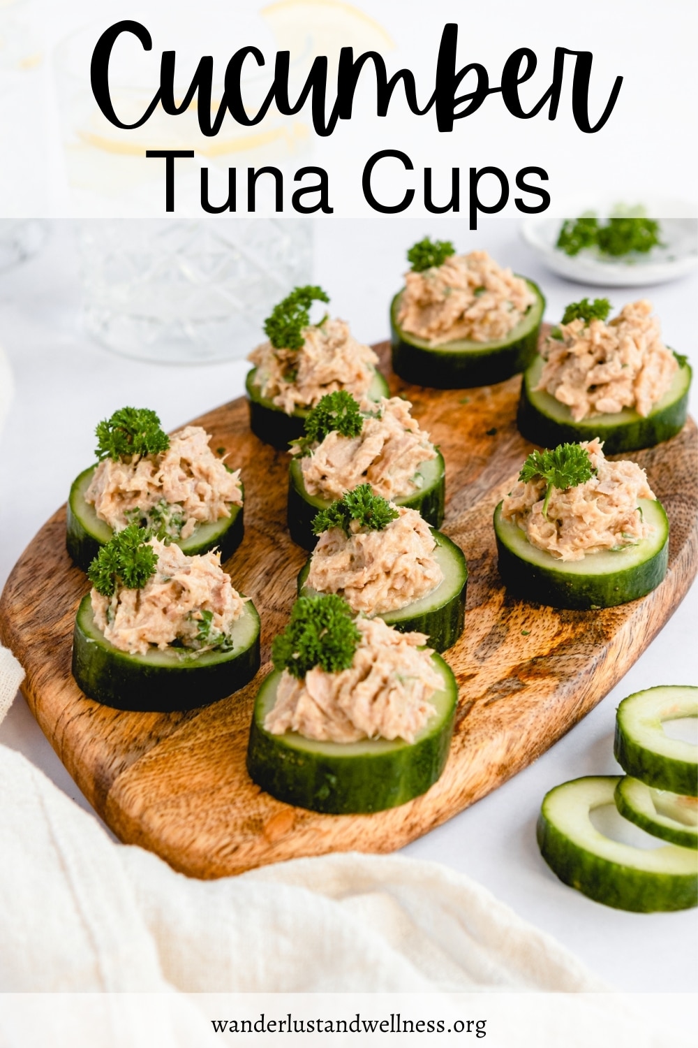 cucumber tuna cups on a wooden board