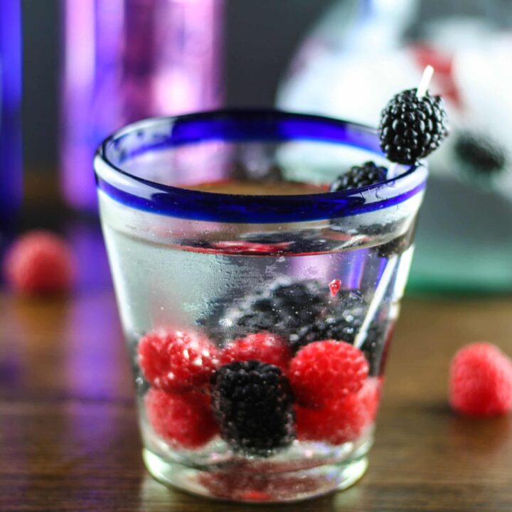 a la croix berry vodka spritzer in a low ball glass