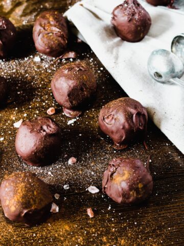 chocolate pumpkin truffles on a wooden table