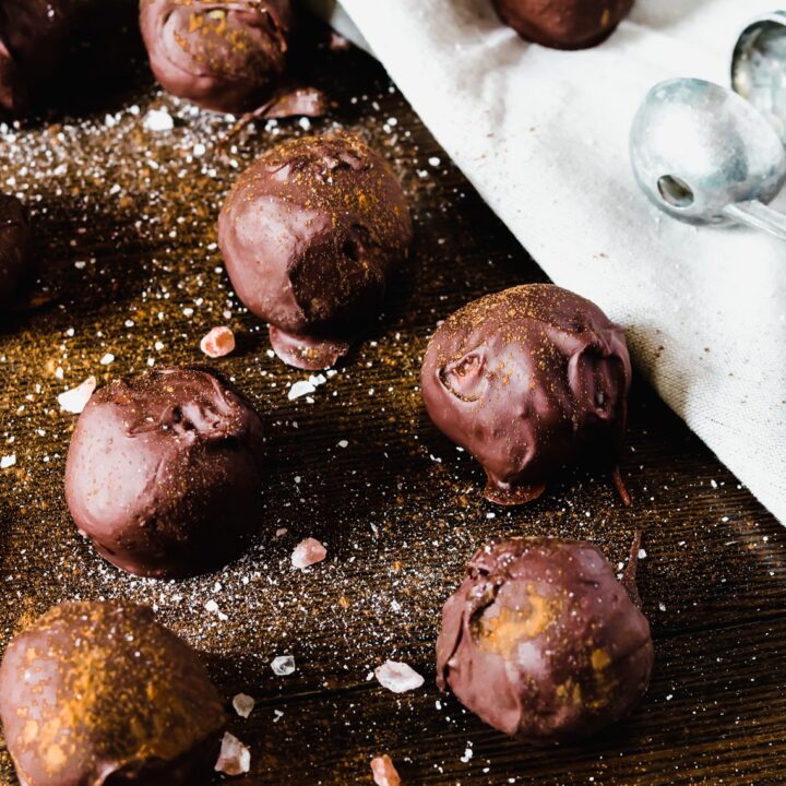 chocolate pumpkin truffles on a wooden table