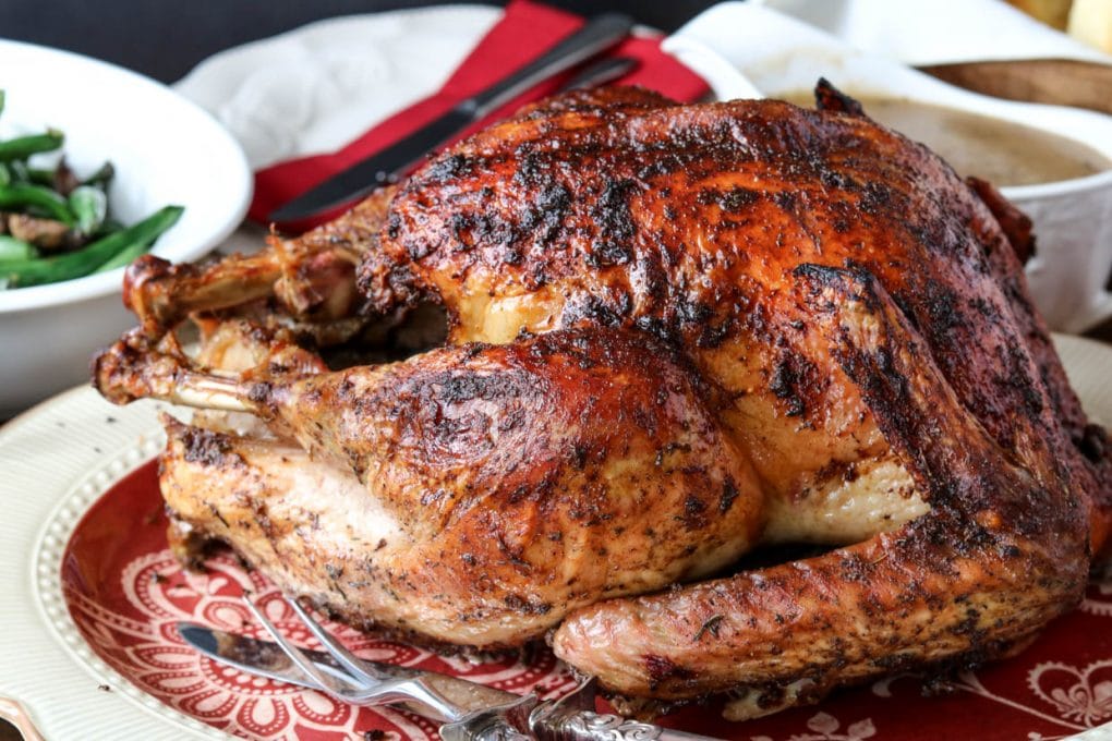 maple herb turkey on a platter for Thanksgiving dinner