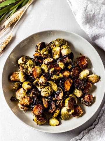 a bowl of honey caramelized brussel sprouts