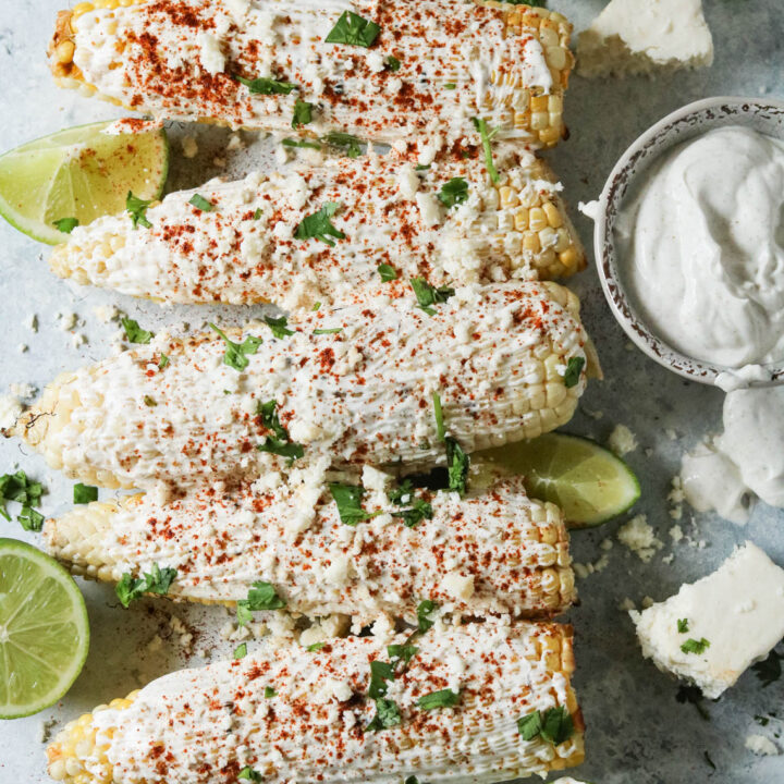 five ears of grilled Mexican street corn