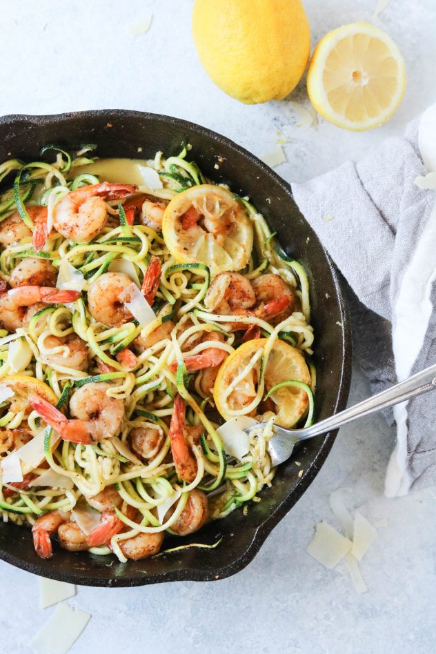 blackened lemon shrimp with zucchini noodles in a cast iron skillet