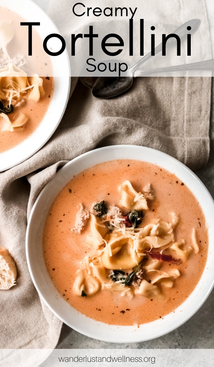 two bowls of creamy tomato tortellini soup