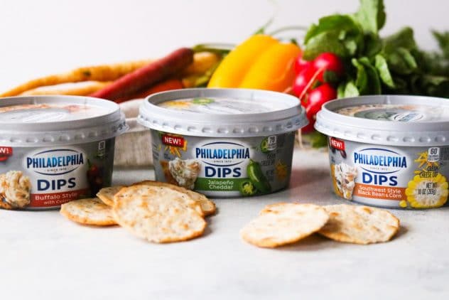 three containers of the NEW PHILADELPHIA Dips with fresh vegetables and crackers