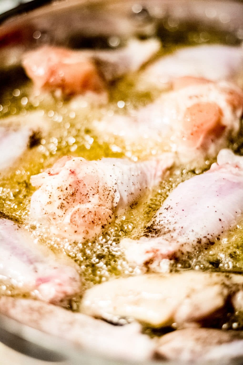 chicken wings pan frying in oil