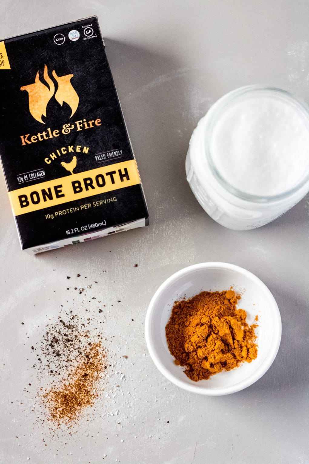 ingredients for a bone broth turmeric latte sitting on a table