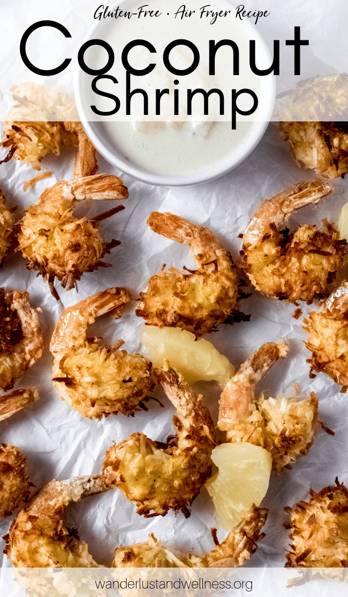 gluten-free air fryer coconut shrimp laying on parchment paper