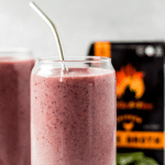 a berry bone broth smoothie in a clear glass