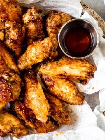 a bowl of chicken wings with maple syrup