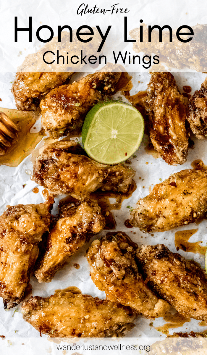honey lime chicken wings laying on parchment paper