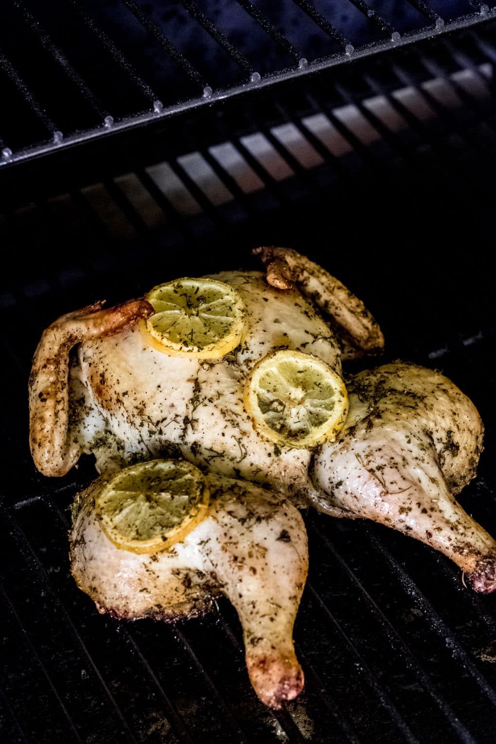 whole chicken on a grill