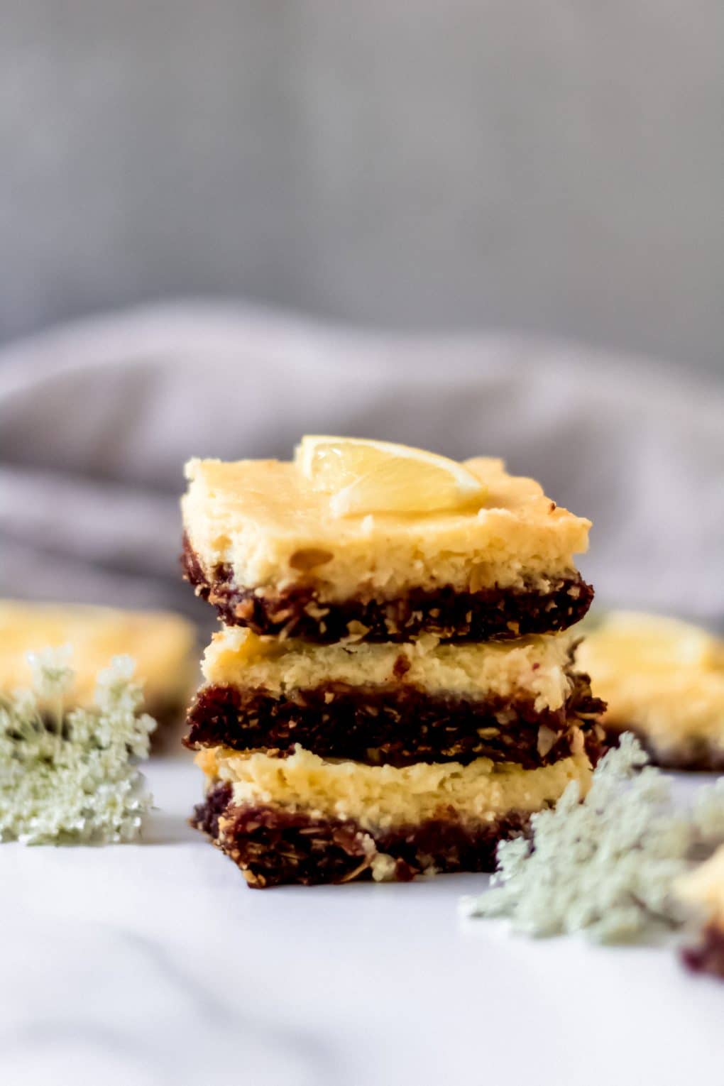 three gluten-free lemon bars stacked on top of one another