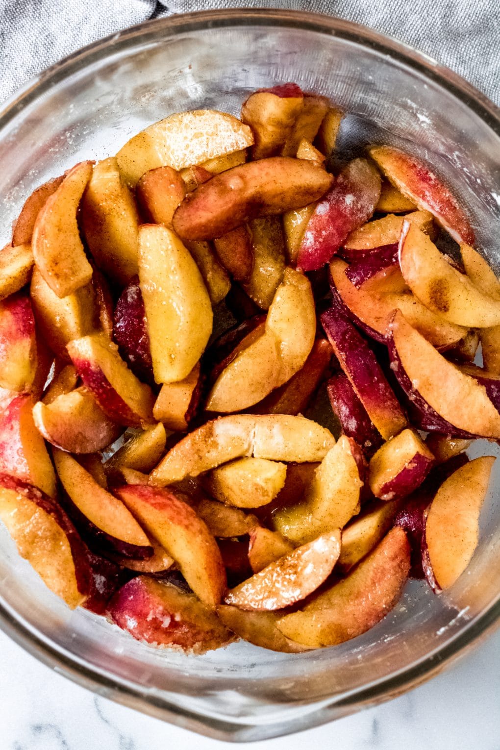 sliced peaches in a mixing bowl