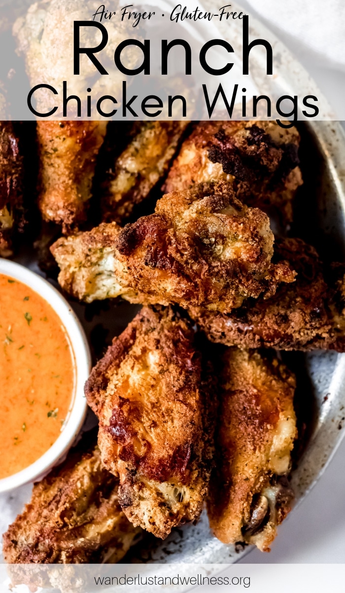 a bowl of ranch chicken wings with buffalo ranch dipping sauce