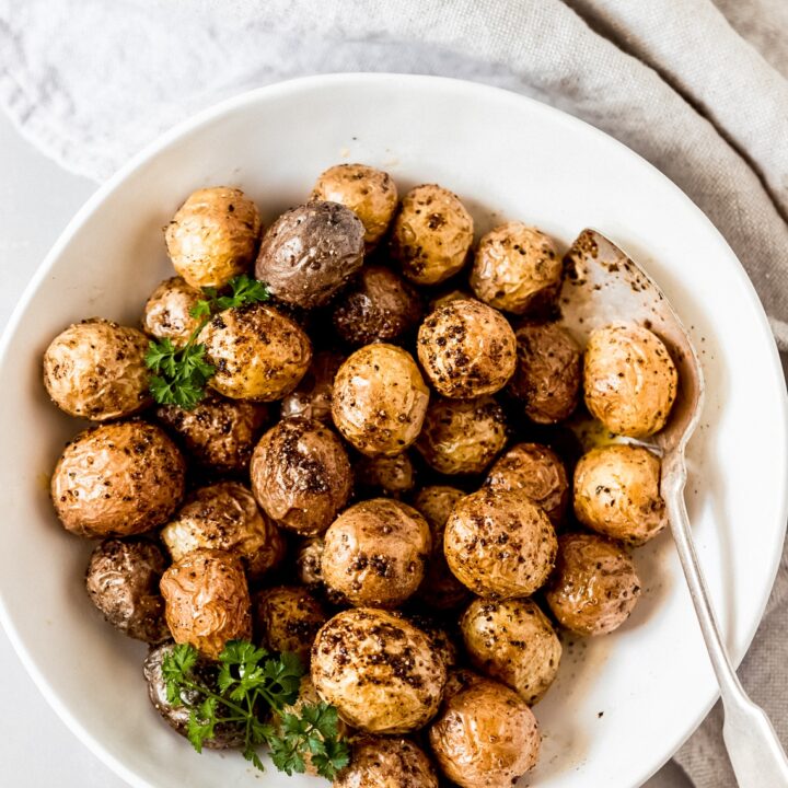 air fryer roasted potatoes in a white bowl