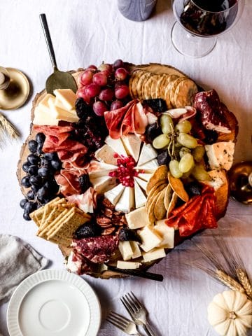 a thanksgiving charcuterie board on a wooden platter