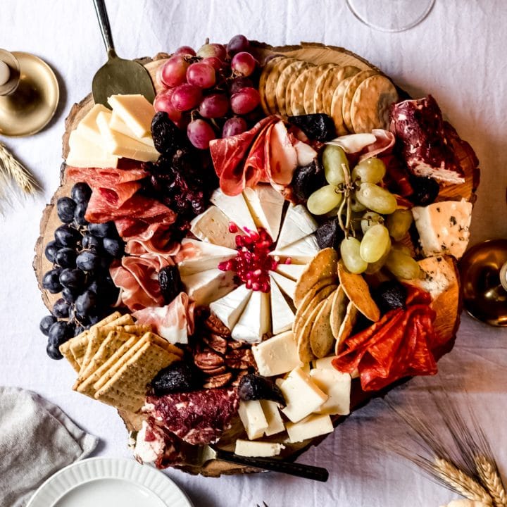 a thanksgiving charcuterie board on a wooden platter