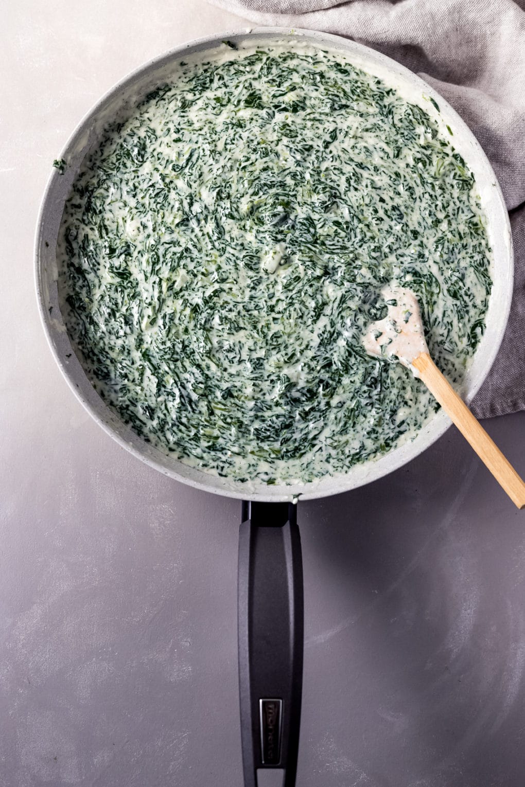 creamed spinach cooking in a skillet