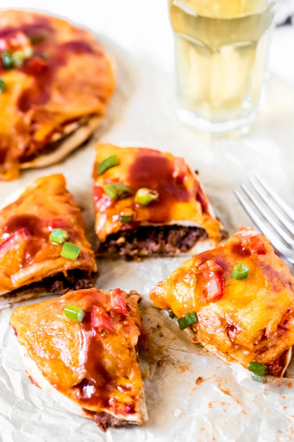 an air fryer Mexican pizza sliced into four sections