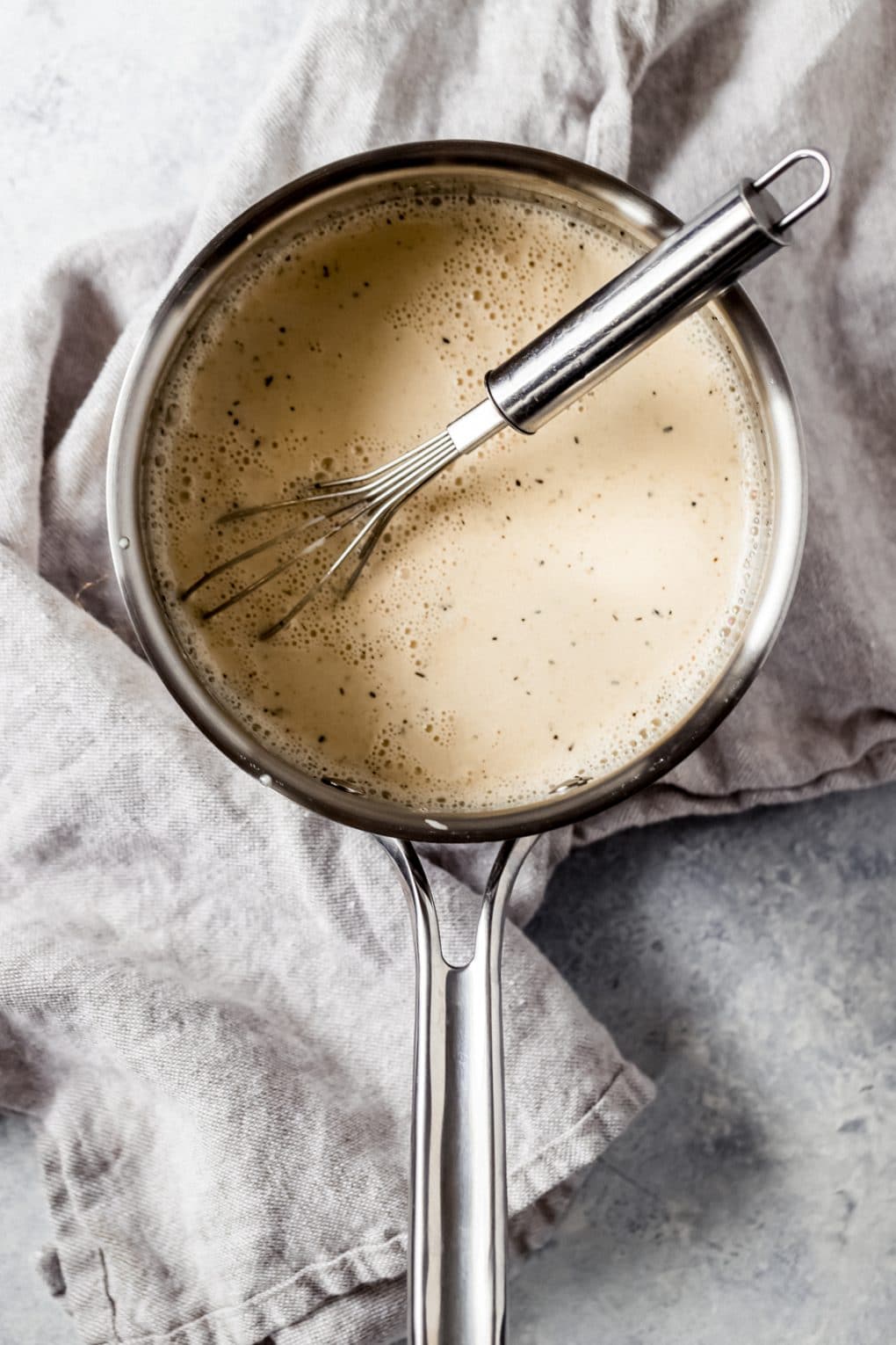 heavy cream and earl grey tea cooking in a saucepan