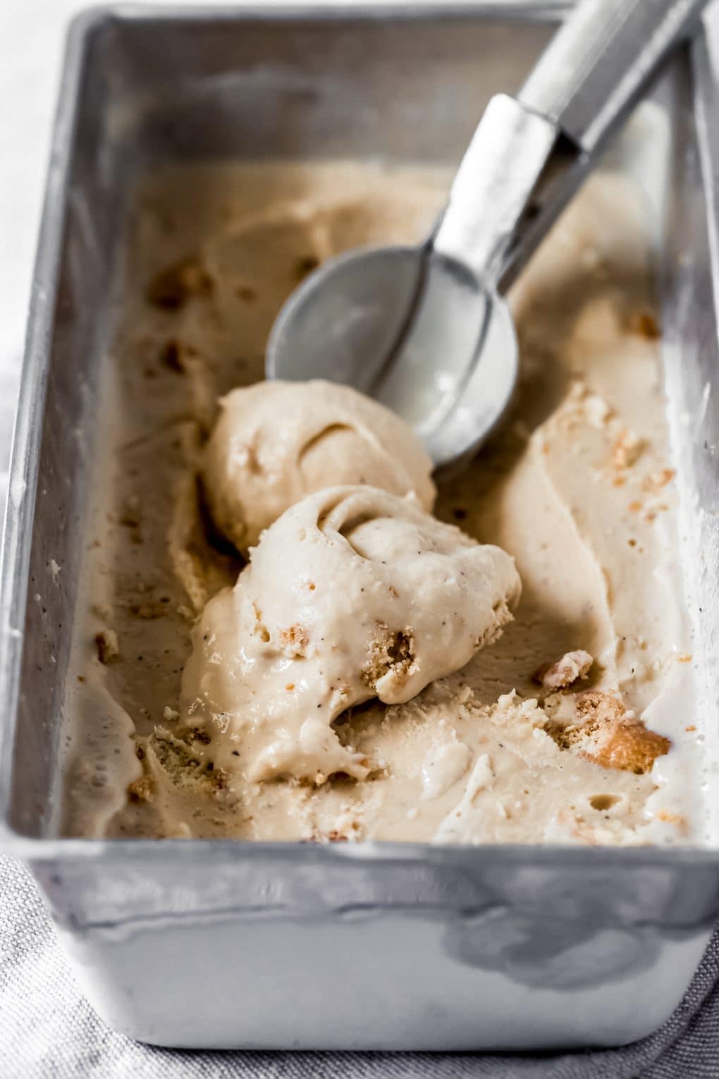 London fog ice cream in a metal container with an ice cream scoop