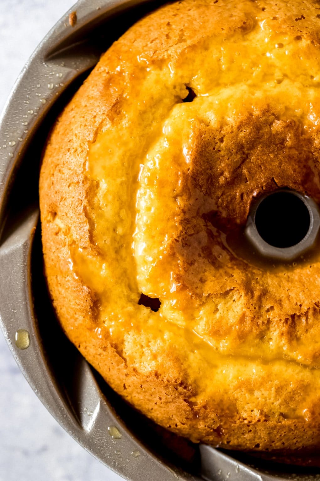 a baked rum cake in a bundt pan