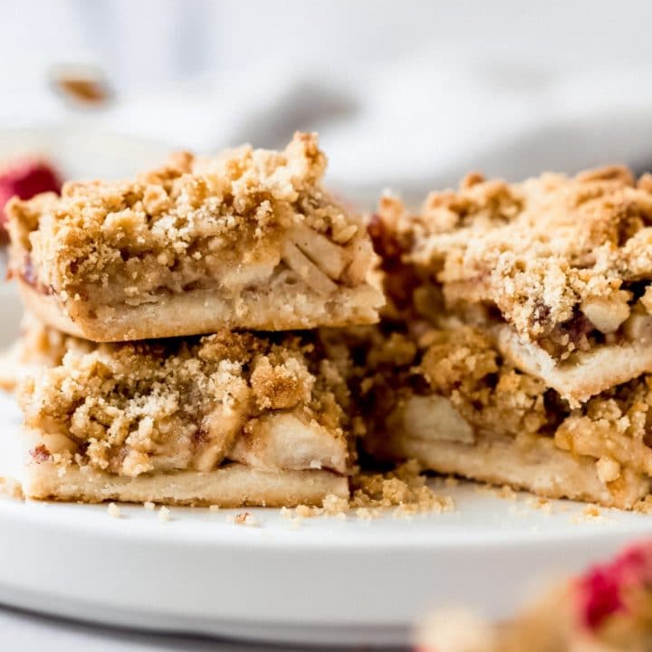 several apple pie shortbread bars on a plate