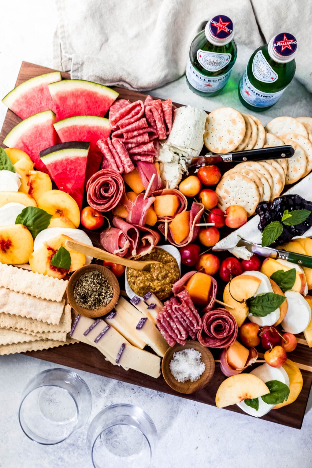 a Labor Day charcuterie board with two bottles of sparkling water