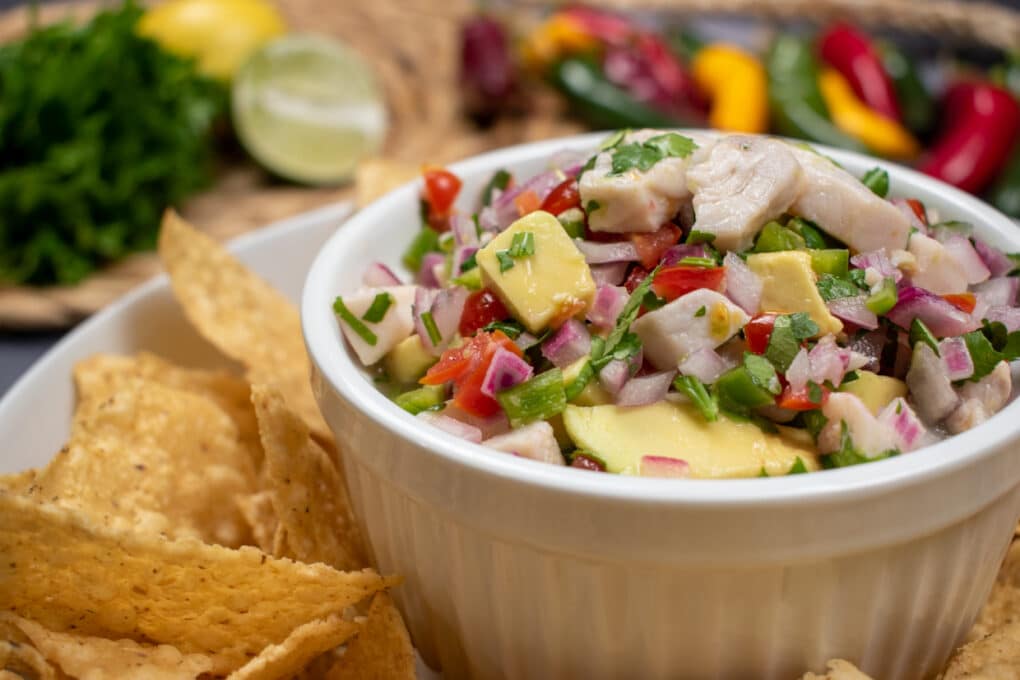 Mahi Mahi Ceviche in a bowl surrounded by tortilla chips