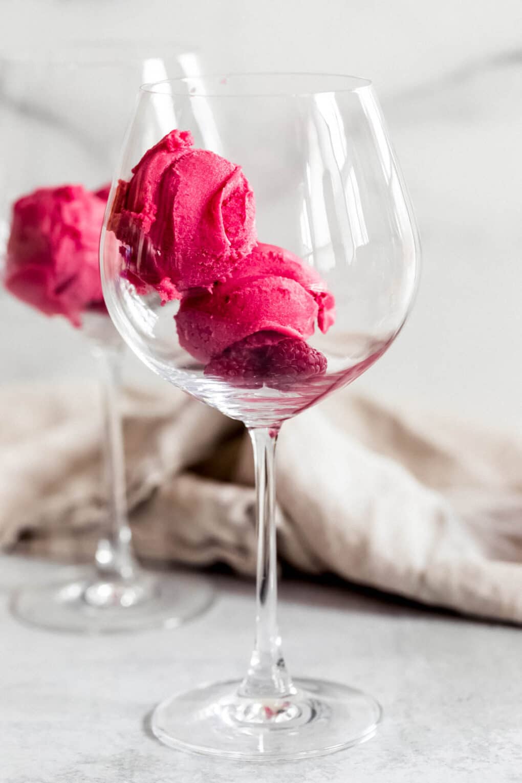 raspberry sorbet in a large wine glass