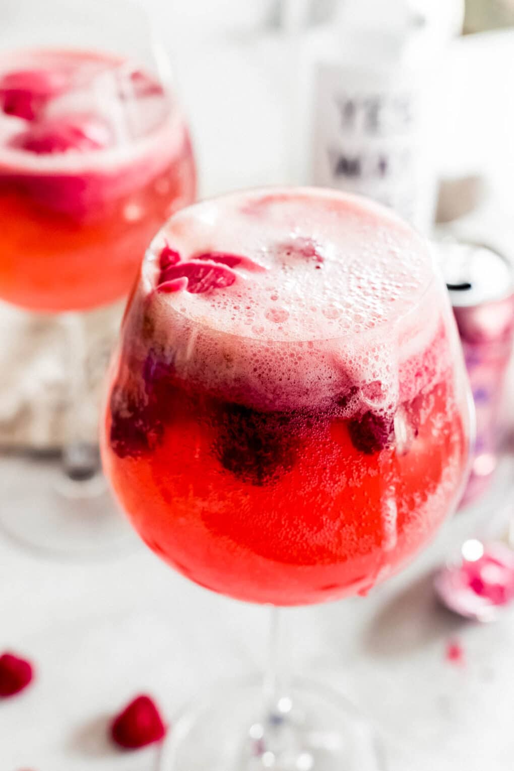 a glass of raspberry sorbet la croix cocktail