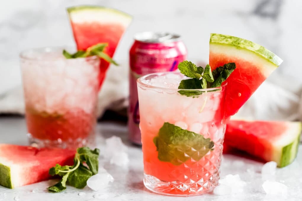 A picture of two watermelon la Croix vodka fizz cocktails with fresh watermelon garnishes